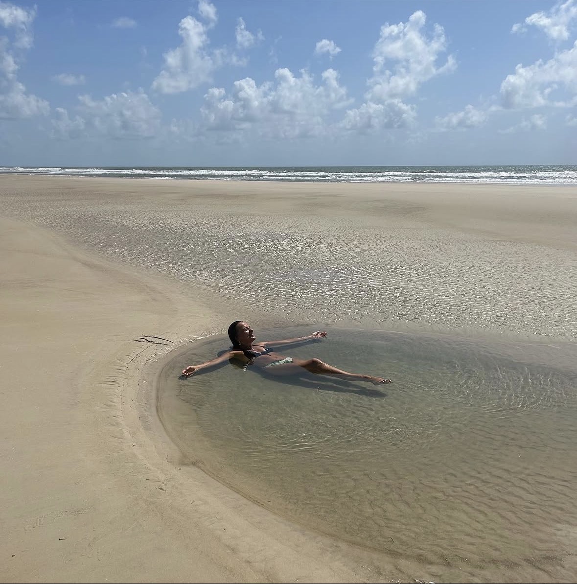 Viviane resting peacefully in a natural ocean pool